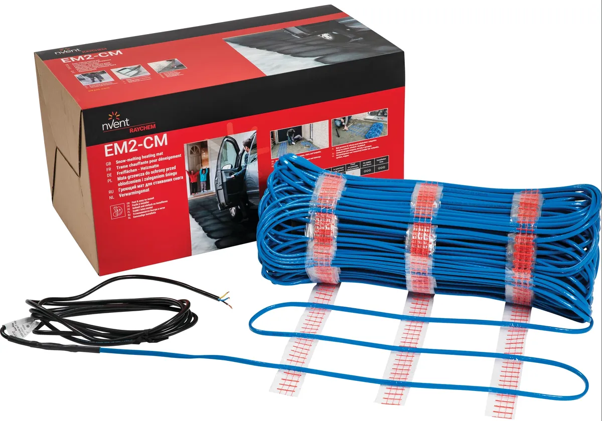 Raychem EM2-CM-MAT constant wattage cable mat rolled up and attached to a power lead, coloured blue, next to the box packaging it comes in.